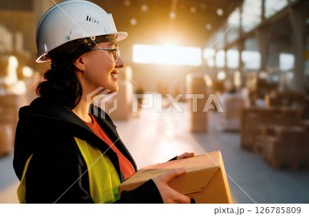 Young woman is working in warehouse 126785809
