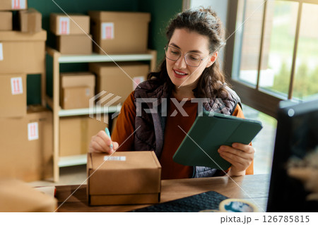 Woman working in a warehouse 126785815