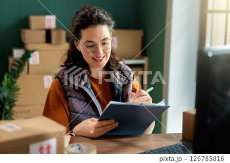 Woman working in a warehouse Woman working in a warehouse 126785816