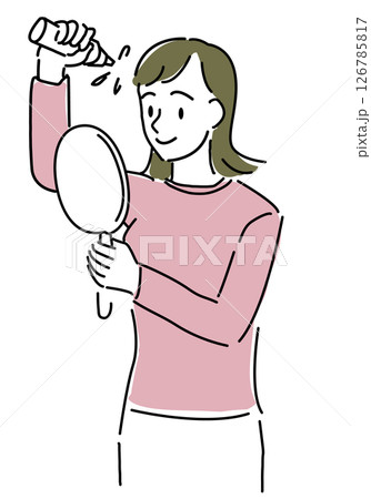 育毛剤を髪につけてヘアケアする女性 126785817