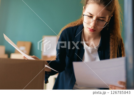 Woman working in a warehouse 126785843