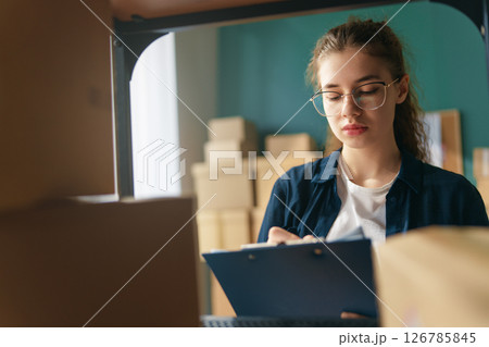 Woman working in a warehouse 126785845