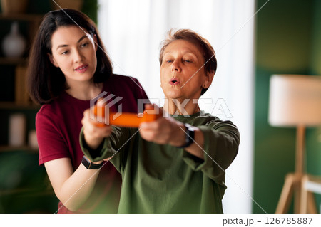 Senior woman doing dumbbell exercise Senior woman doing dumbbell exercise 126785887