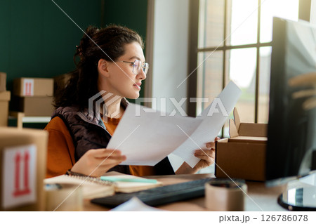 Woman working in a warehouse Woman working in a warehouse 126786078