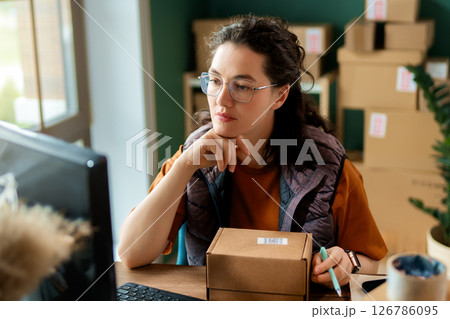 Woman working in a warehouse 126786095