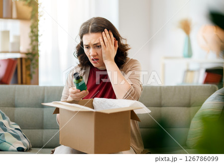 Woman is unpacking cardboard 126786099