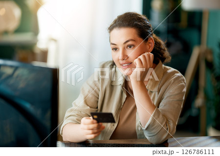 Woman is doing online purchases Woman is doing online purchases 126786111