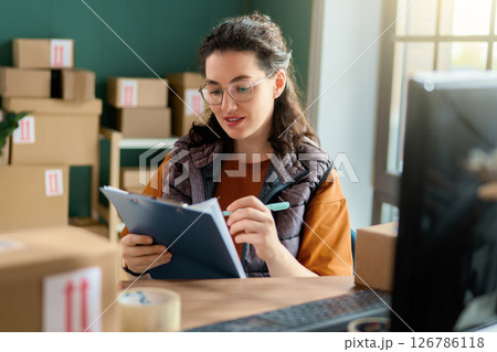 Woman working in a warehouse 126786118