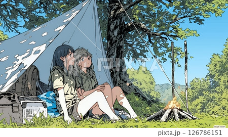 女友達と一緒にテントキャンプを楽しむ若い女性