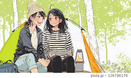女友達と一緒にテントキャンプを楽しむ若い女性