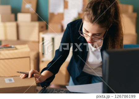 Woman working in a warehouse 126786199