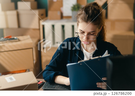 Woman working in a warehouse 126786200