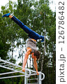 Healthy lifestyle concept. Training outdoors. Handsome sport man doing crossfit pushups in the park on the sunny morning. High quality photo Healthy lifestyle concept. Training outdoors. Handsome sport man doing crossfit pushups in the park on the sunny morning. High quality photo 126786482