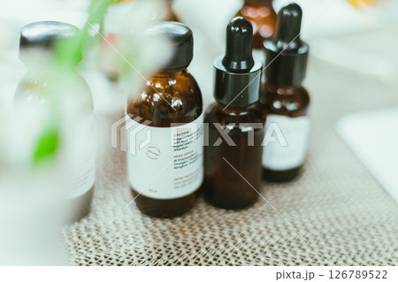 Shot of mature perfumer adding extra essential oil 126789522