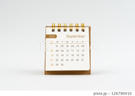 September 2025 Mini desk calendar on white. 126790410