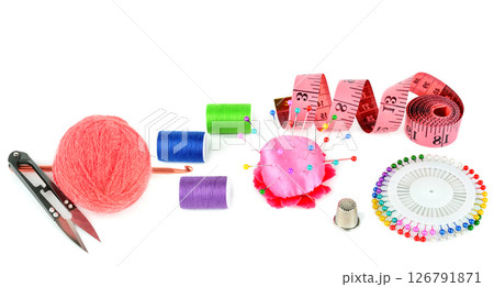 Sewing supplies (thread, scissors and measuring tape, crochet hook ) isolated on a white background. Collage. 126791871