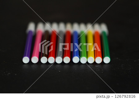 Multi-colored markers for drawing. Markers on a black isolated background 126792816