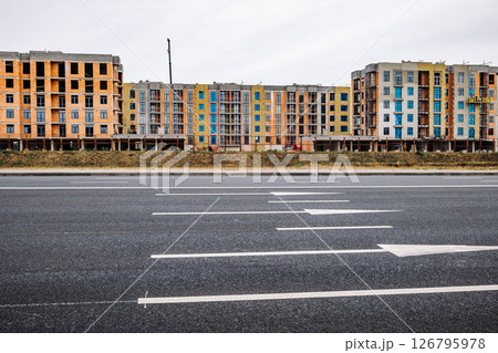 Construction site of new apartment buildings along the highway 126795978