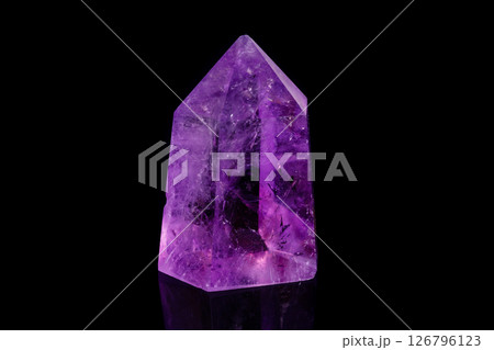 Macro mineral stone Amethyst crystal on a black background 126796123