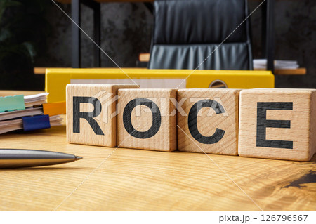 ROCE on an office desk symbolizing capital productivity. 126796567