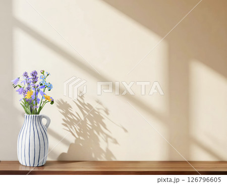 A Beautiful Arrangement of Fresh Flowers in a Vase, Bathed in Gentle Sunlight and Shadows 126796605