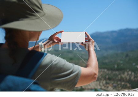 Traveler Taking a Photo of Mountain Scenery With Smartphone Traveler Taking a Photo of Mountain Scenery With Smartphone 126796918