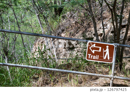 Selective focus on inclined hiking sign along the trail to the summit of Diamond Head State Monument in Oahu, Hawaii  126797425