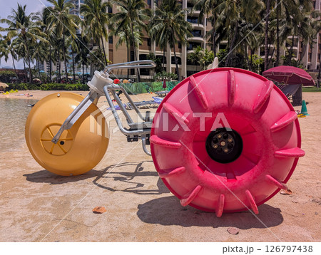 Selective focus of a rental floating paddle bike at a tropical resort. Selective focus of a rental floating paddle bike at a tropical resort. 126797438