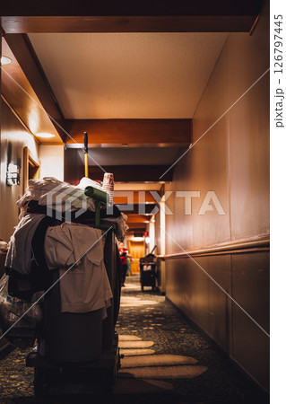 Hotel hallway with room service cleaning cart with supplies. Hotel hallway with room service cleaning cart with supplies. 126797445