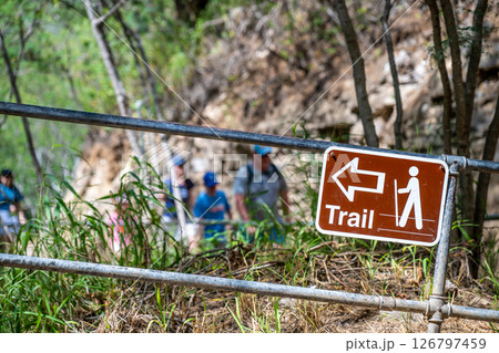 Selective focus on inclined hiking sign along the trail to the summit of Diamond Head State Monument in Oahu, Hawaii  126797459