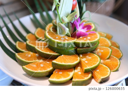 vietnamese green oranges cut on plate white beautiful decoration flowers buffet hotels restaurant 126800635