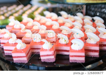 Pink layered desserts Colorful Ice Cream Cones Summer Desserts, Melting on a Light Pink Background. 126800677