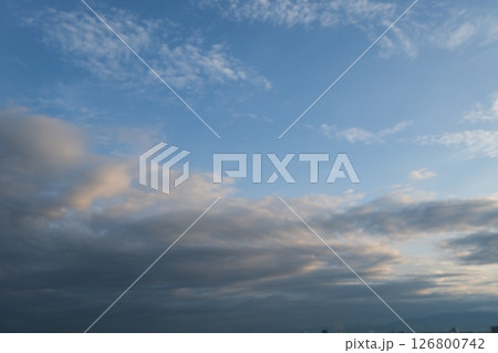 sky is blue and clear with no clouds. The sky is very bright and the sun is shining 126800742