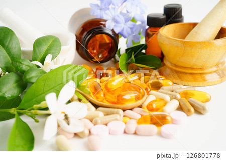 Alternative medicine herbal organic capsule with vitamin E omega 3 fish oil, mineral, drug with herbs leaf natural supplements for healthy good life. Alternative medicine herbal organic capsule with vitamin E omega 3 fish oil, mineral, drug with herbs leaf natural supplements for healthy good life. 126801778