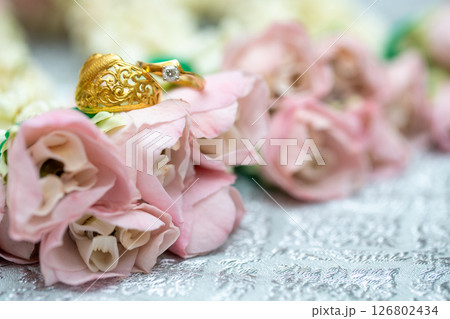 Gold ring , Wedding ring,Diamond ring on the flowers. 126802434