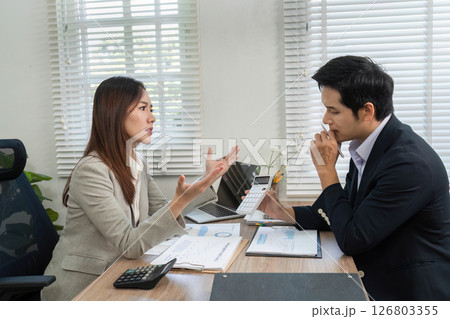 Financial Consultation. Engaging discussion between a financial advisor and client in a modern office. Financial Consultation. Engaging discussion between a financial advisor and client in a modern office. 126803355