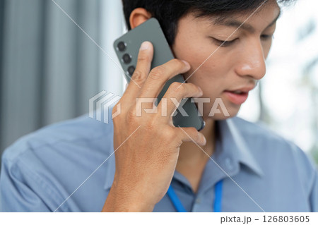 Remote Work and Digital Transformation. Professional on phone call discussing projects. 126803605