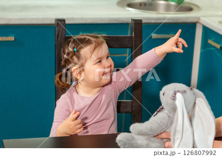 Little Caucasian girl engaged in fun activity with her mother at home. Concept of cognitive development, preschool education, and nurturing 126807992