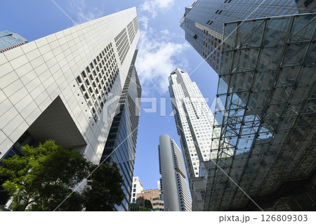Low-angle building view of the modern office skyscrapers in the financial district of Raffles Place, Singapore. 126809303