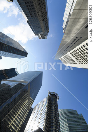 Low-angle building view of the modern office skyscrapers in the financial district of Raffles Place, Singapore. 126809305
