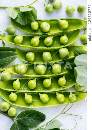 Fresh green peas beans in pods, white background, macro photo Fresh green peas beans in pods, white background, macro photo 126810779