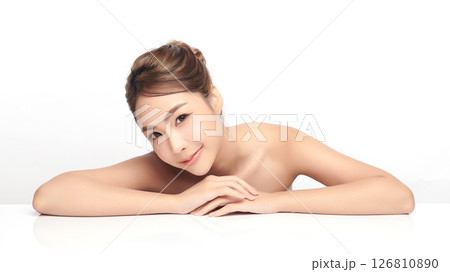 A beautiful young Asian woman with clean, fresh skin against a white background. Skincare, facial treatment, cosmetology, beauty, and spa. An elegant portrait of an Asian woman. A beautiful young Asian woman with clean, fresh skin against a white background. Skincare, facial treatment, cosmetology, beauty, and spa. An elegant portrait of an Asian woman. 126810890