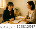 進路相談に耳を傾ける先生と安堵する女子学生 126812547