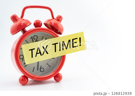 Tax time word with red alarm clock on white background. Tax time word with red alarm clock on white background. 126812939