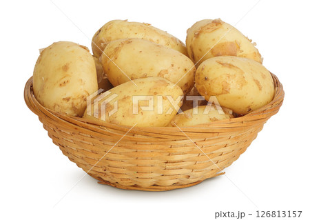 young potato slices in a wicker basket isolated on white background. Harvest new 126813157