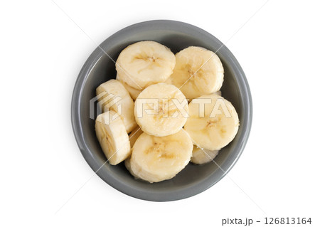 peeled banana pieces in ceramic bowl isolated on white background. Top view. Flat lay. peeled banana pieces in ceramic bowl isolated on white background. Top view. Flat lay. 126813164