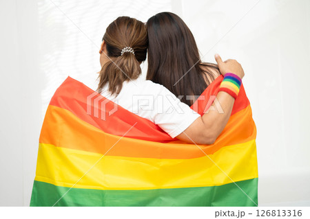 Asian couple woman with LGBT rainbow flag. 126813316