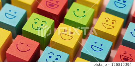 Mind and mental Health Concepts. Happy Community. World Happiness, International Smiling Day. Group of Smiling Emoticon Diversity Face on Multi-colour Cube. Closeup shot 126813394
