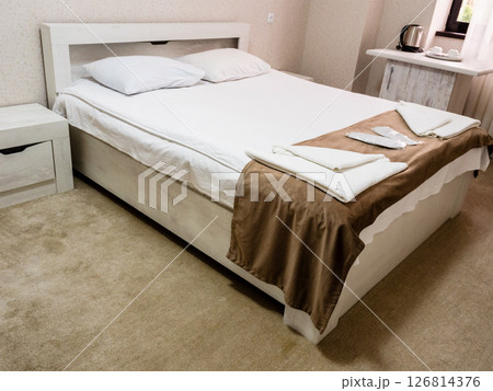 interior of standart hotel room with double bed 126814376