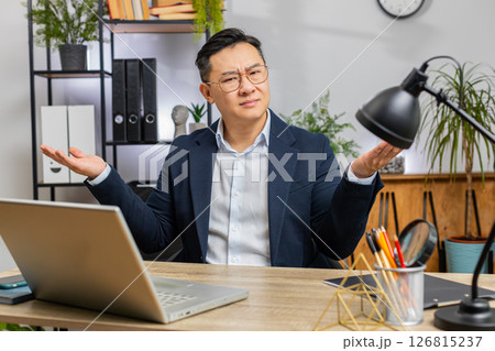 Confused businessman embarrassed about ambiguous question, having doubts, no answer idea, clueless Confused businessman embarrassed about ambiguous question, having doubts, no answer idea, clueless 126815237